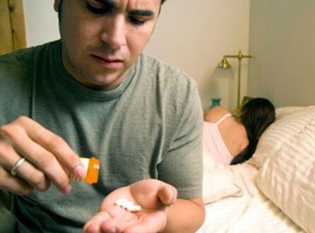 a man taking pills for prostatitis